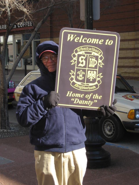 Cecil_H._with_SACC_sign.JPG